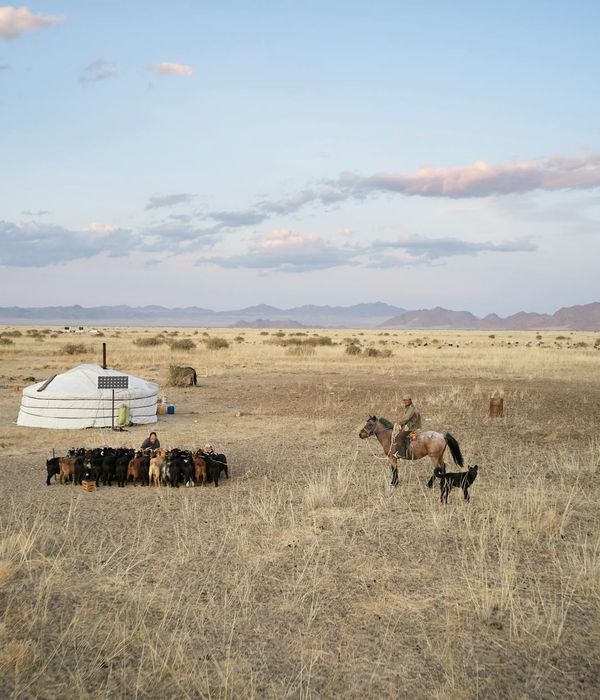 Endless steppe grasslands with nomadic yurt settlement